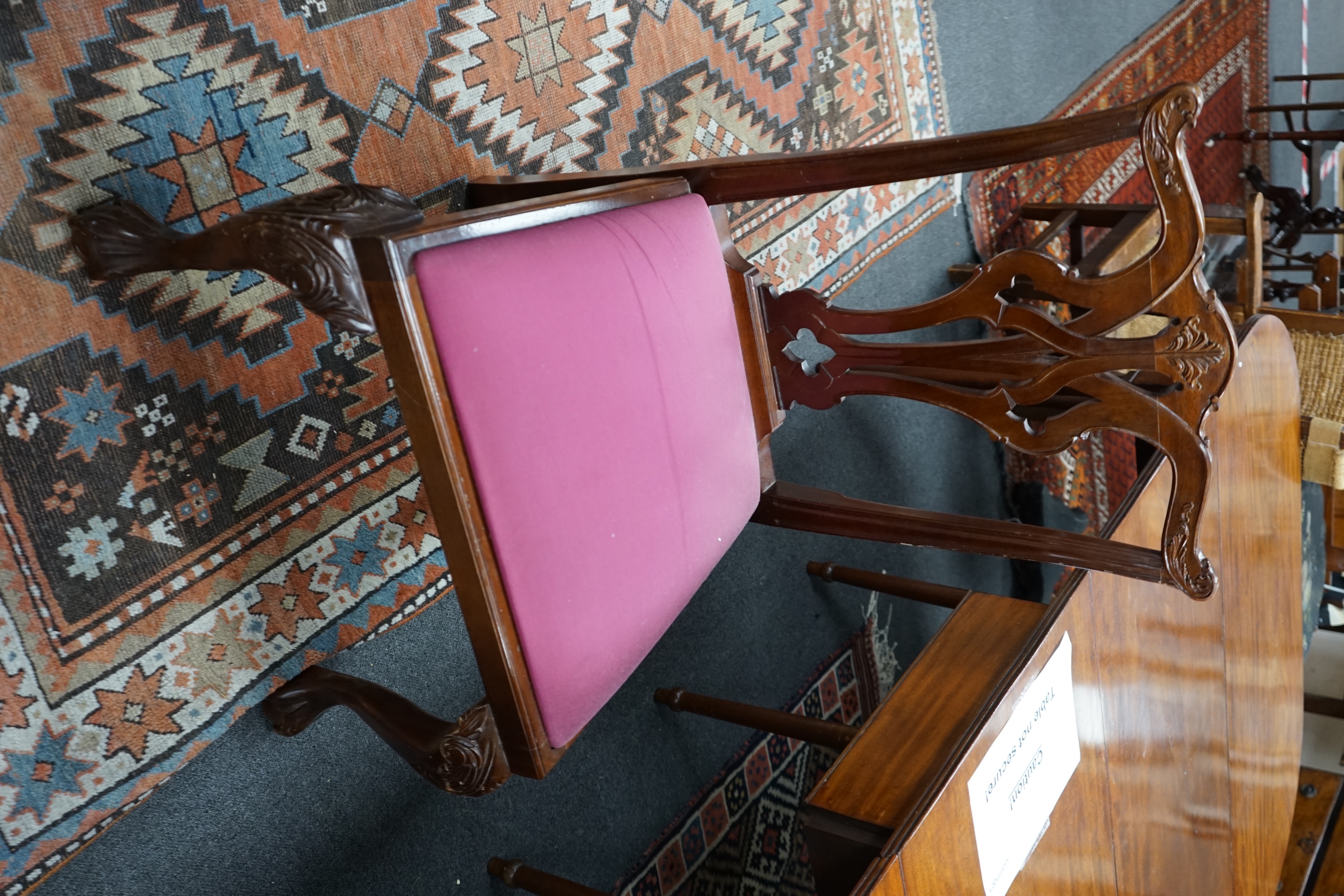 A George III mahogany D end extending dining table and six reproduction Chippendale style mahogany dining chairs, table 275cm extended, width 137cm height 74cm